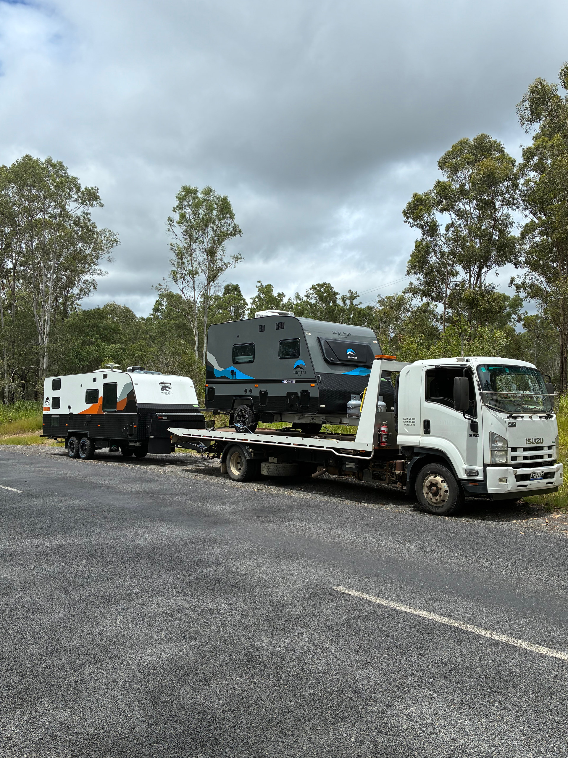 Two caravans being towed by our tilt tray, one on the flatbed and one behind